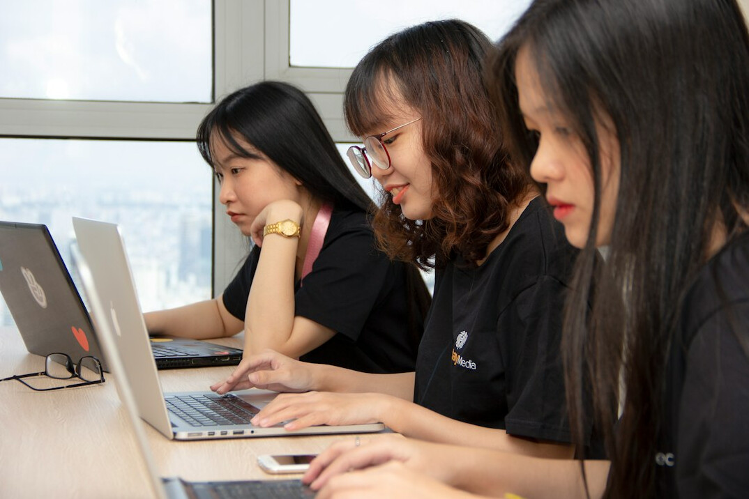 group of students coding together