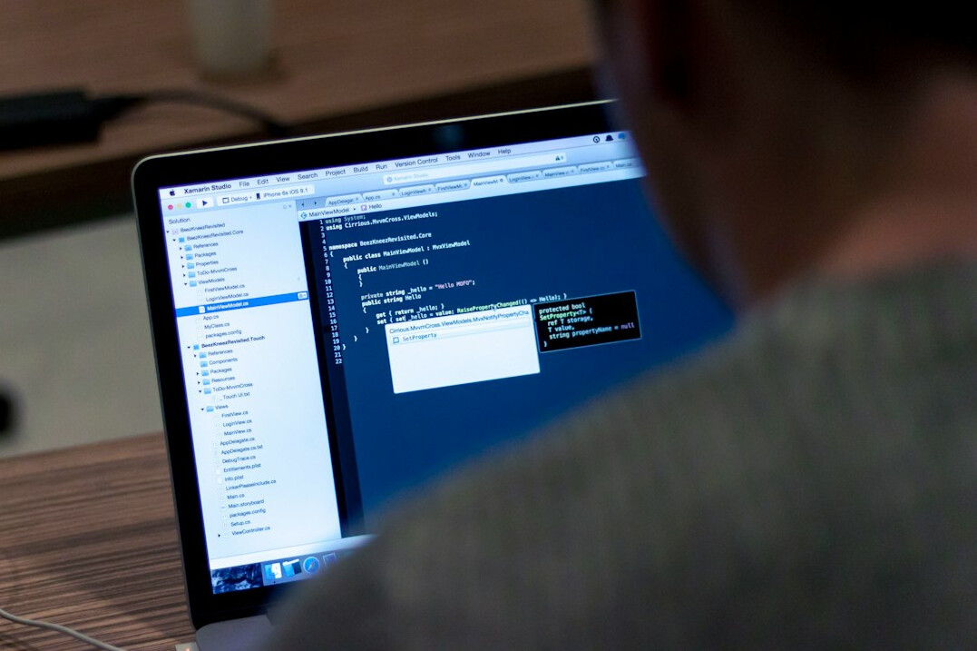 person reviewing code on screen