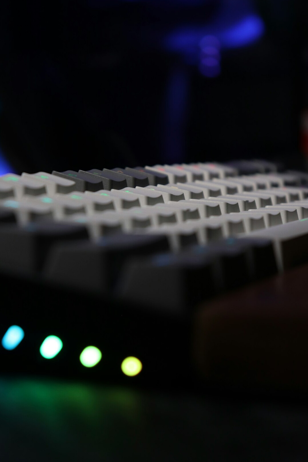 Close up of hands typing on a mechanical keyboard