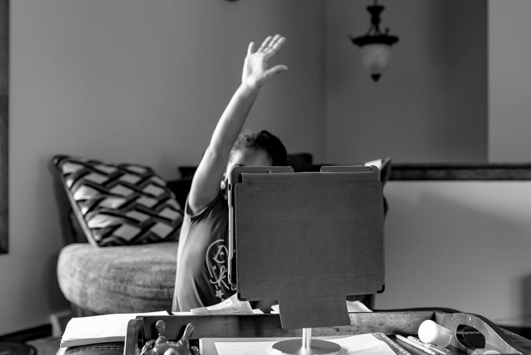 Young Croatian woman writing code on a laptop at home